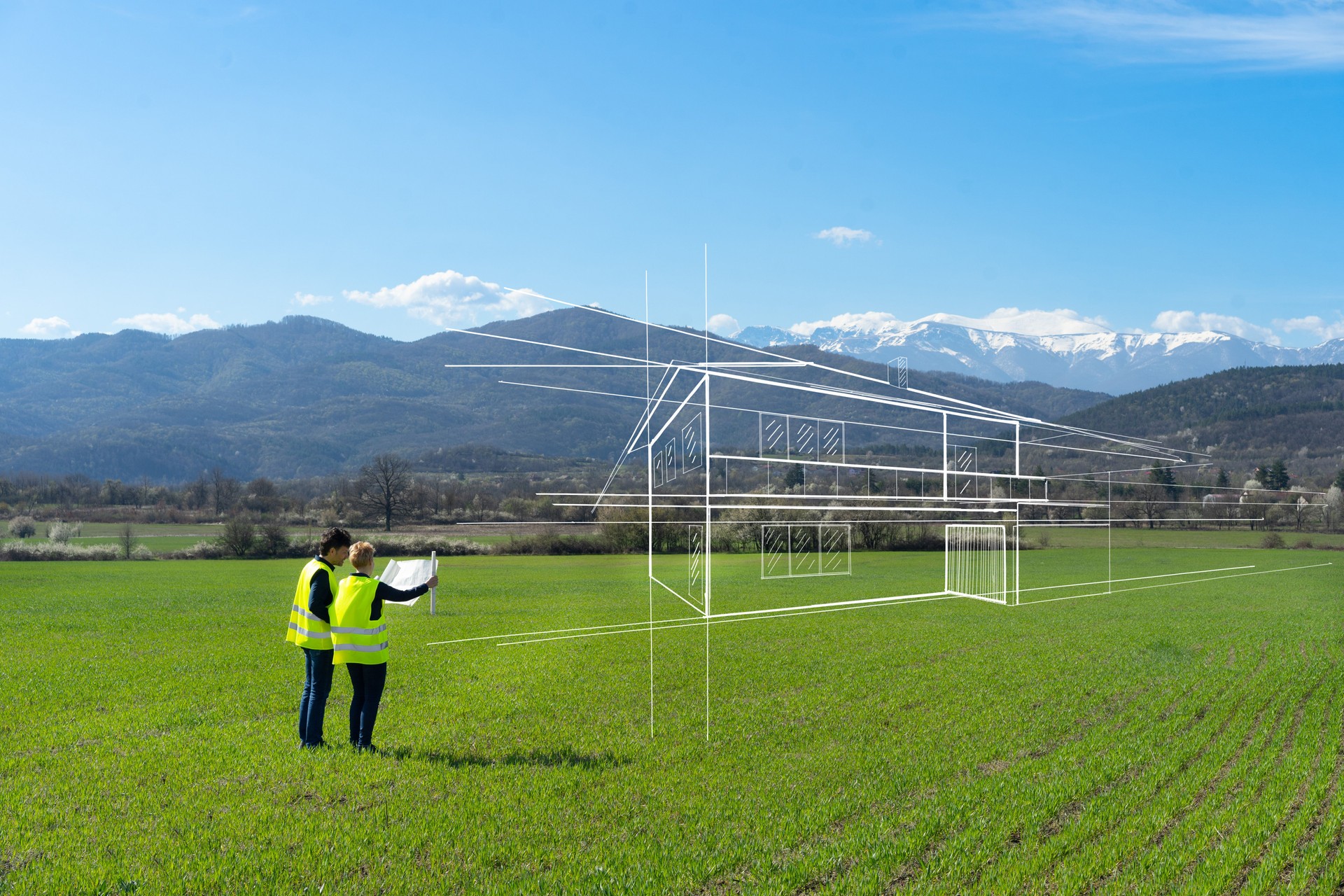 A couple planning a new house against a moutain backdrop